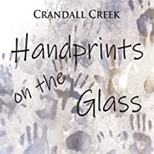 CD HANDPRINTS ON THE GLASS